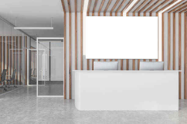 istock White reception desk and poster in wooden office 1274134013