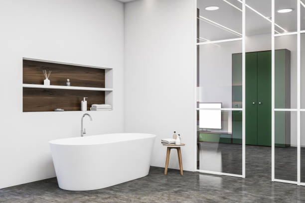 istock White bathroom corner with tub and shelf 1274139730
