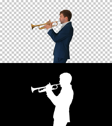 Medium shot. Side view. Young man in suit playing a trumpet, Alpha Channel with Silhouette Professional shot. 047. You can use it e.g. in your medical, commercial video, business, presentation, broadcast
