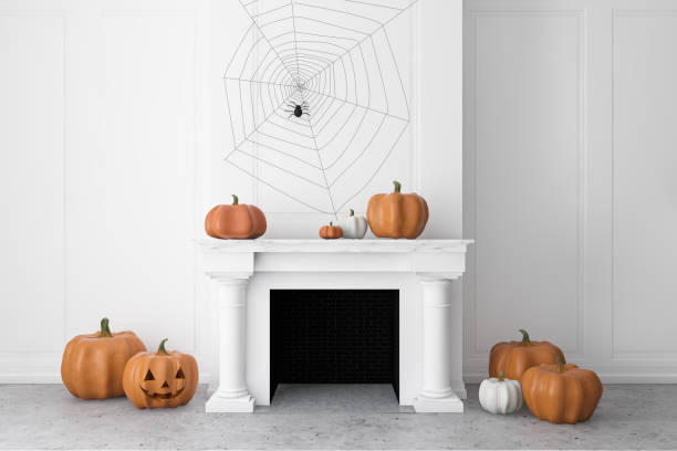 istock White fireplace with carved pumpkins 1274143722