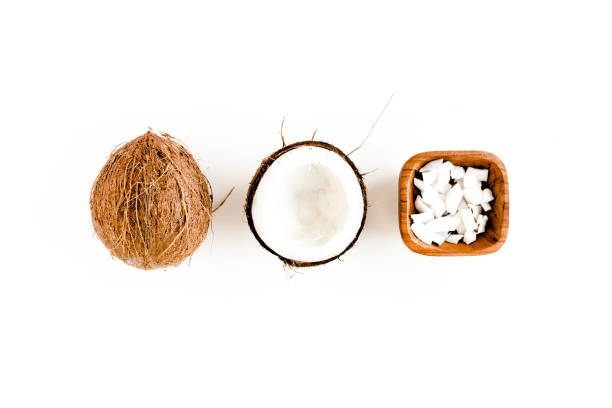 istock Pattern with coconuts and tropical palm leaves on white background. Tropical abstract background. Flat lay, top view 1274148975