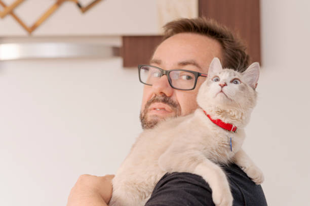 istock Cat on shoulder of young woman 1274153266