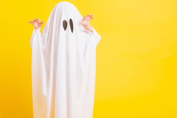 istock little cute child with white dressed costume halloween ghost scary 1274219753