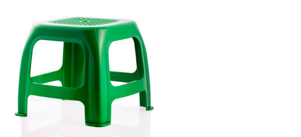 istock Green plastic chair isolated on white background. 1274222114