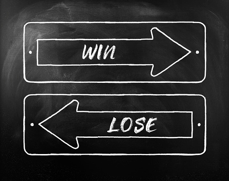 Choice Win or Lose written on opposite arrows on Blackboard