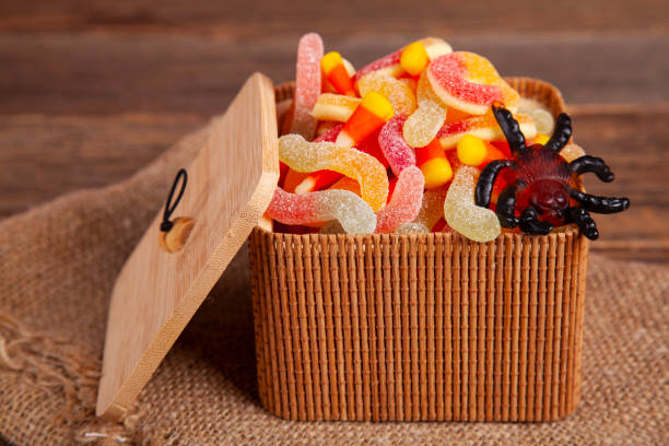 istock Bowl of Halloween Candy Corns on Rustic Wooden Table 1274296511