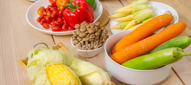 istock Fresh vegetable and fruit on wooden table in kitchen 1274339678