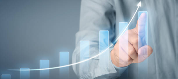 istock Businessman plan graph growth and increase of chart positive indicators in his business 1274376352