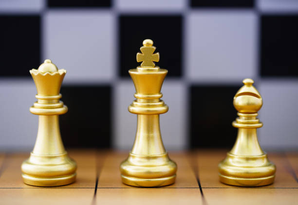 istock Gold king chess piece stand on wood chessboard 1274378987