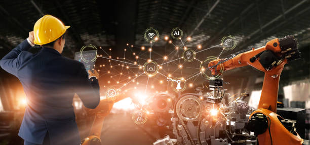 istock Manager engineer check and control automation robot arms machine in intelligent factory industrial on real time monitoring data software. Welding robotics and manufacturing operation. 1274394137