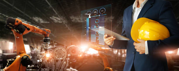 istock Manager engineer check and control automation robot arms machine in intelligent factory industrial on real time monitoring data software. Welding robotics and manufacturing operation. 1274394139