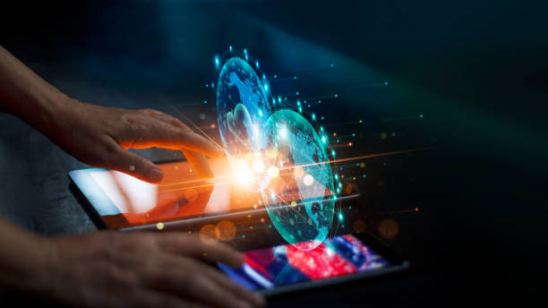 istock Businessman using tablet and smartphone on colorful global network connection and data exchanges on dark background. Business and communication technology. 1274401228