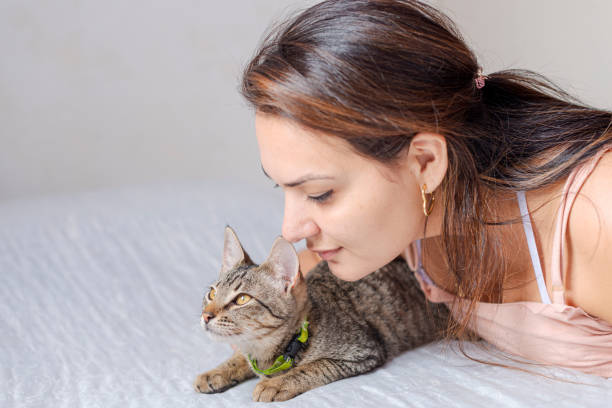 istock Young woman with her pet cat 1274402842