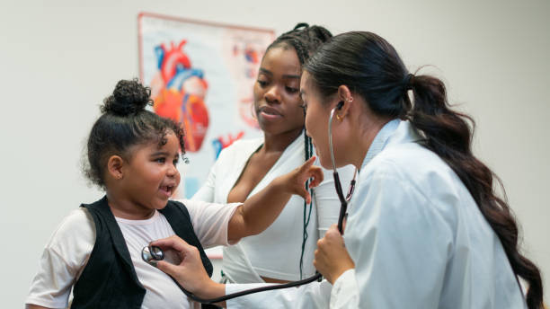 istock Mom and daughter visit the doctor 1274408547