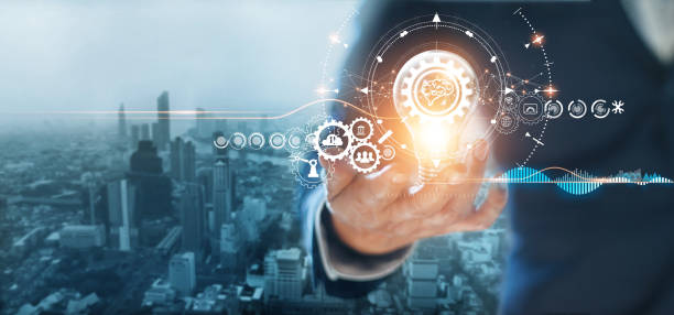 istock Businessman holding light bulb with gears and cogs inside, Symbolic of creativity innovative solution analysis and development contents of business and process workflow on global network connection. 1274423254
