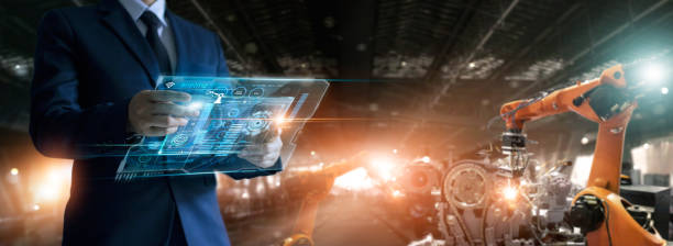 istock Engineer check and control welding robotics automatic arms machine in factory automotive industrial with monitoring system software on virtual interface. Digital manufacturing operation. Industry 4.0 1274433343