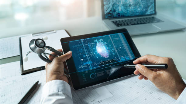 cardiologist doctor with stethoscope. analyzing and touching medical network connection on tablet with modern virtual screen networking interface. medical technology and patient concept - science life medical research healthcare and medicine imagens e fotografias de stock