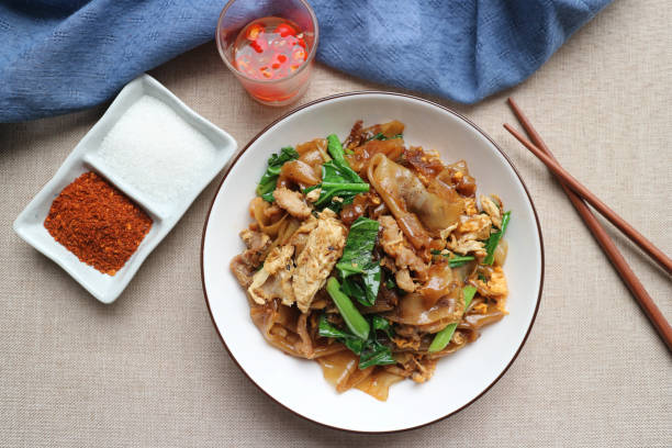 istock Stir-fried flat noodle with sweet black soy sauce and Kale (Thai food called Pad See Ew Moo ) 1274492077