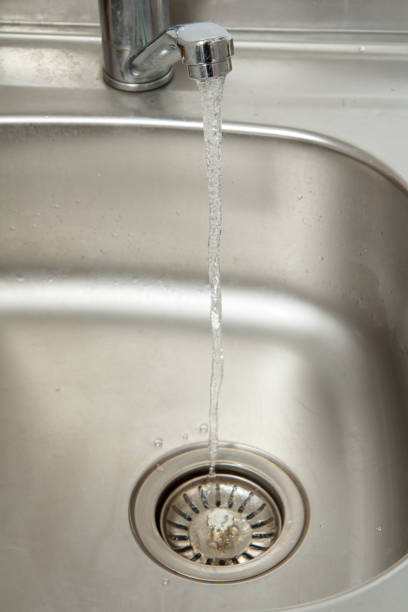 istock Stream of water flows from an open chrome tap 1274559302