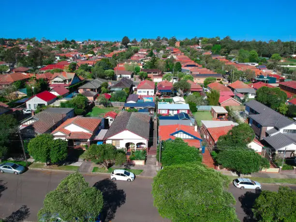 Photo of Panoramic Aerial drone view of Suburban Sydney houses roof tops parks and streets Australia