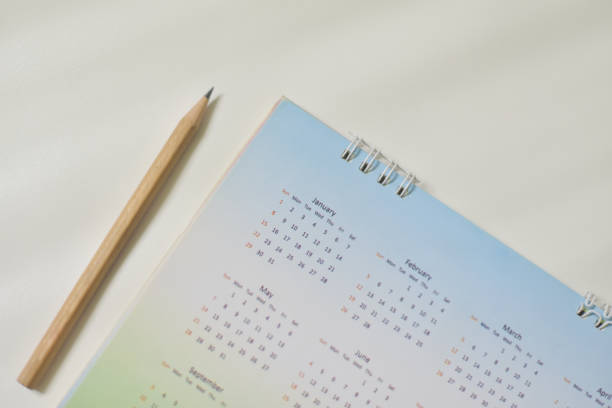 istock Blurred calendar in white tone planning 2021 concept. 1274585234