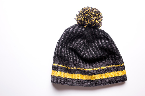 Men's winter hat in gray and yellow on a white background