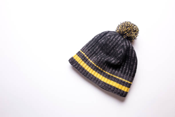 istock Men's winter hat in gray and yellow on a white background 1274595038