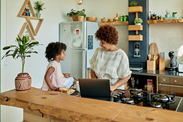 istock Woman Working From Home and Caring for Young Daughter 1274597172