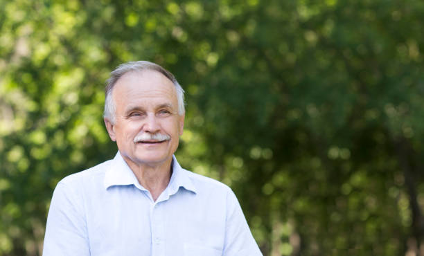 istock Portrait Elderly man smiling outdoors 1274612676