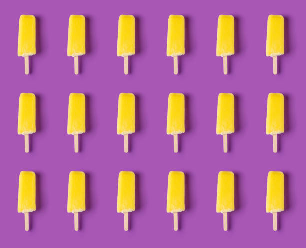 istock seamless yellow popsicle on a purple background 1274615476