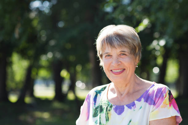 istock happy Senior caucasian woman relaxed  outdoors. copy space 1274617938