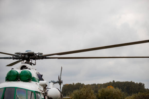 istock Helicopter blades against the sky with clouds 1274625005