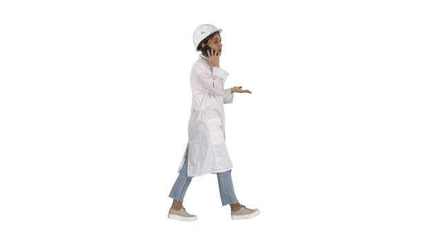 istock Female scientist making a call walking on white background 1274628084