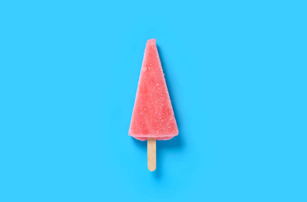 istock top view watermelon shape and flavor popsicle on a blue background 1274638189