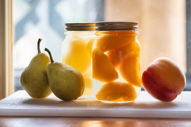 Locally grown pears and peaches - fresh and canned in mason jars.  Okanagan, British Columbia, Canada
