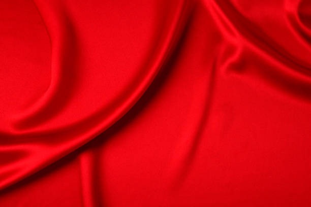 istock Red silk or satin luxury fabric texture can use as abstract background. Top view 1274644421
