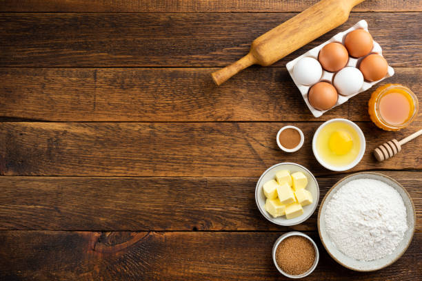 istock Cooking baking ingredients on a wooden table background 1274658517