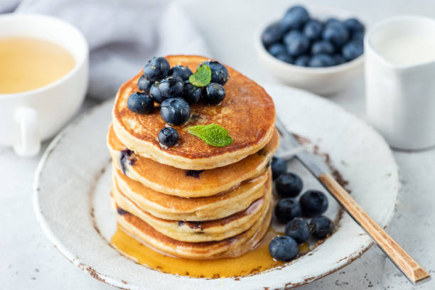 istock Pancakes with blueberries and honey 1274658547