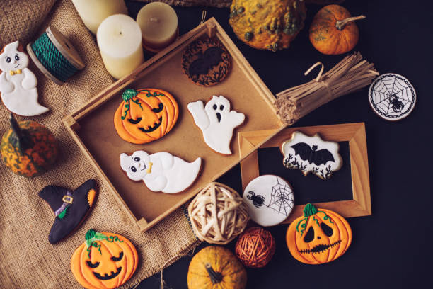 Taking your Halloween decorations out of the box Directly above angle on several miniature Halloween decorations taken out of their box and randomly scattered around the table. halloween treats stock pictures, royalty-free photos & images