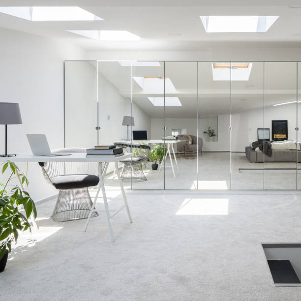 istock Attic room with mirrors on wardrobe doors 1274699682