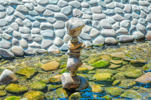 Balance and spa stone composition in a river water. Meditation zen pebbles stack.