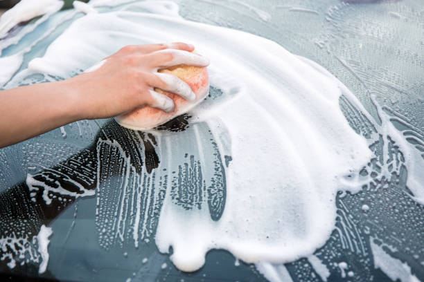 istock male hand with sponge washing car 1274708907