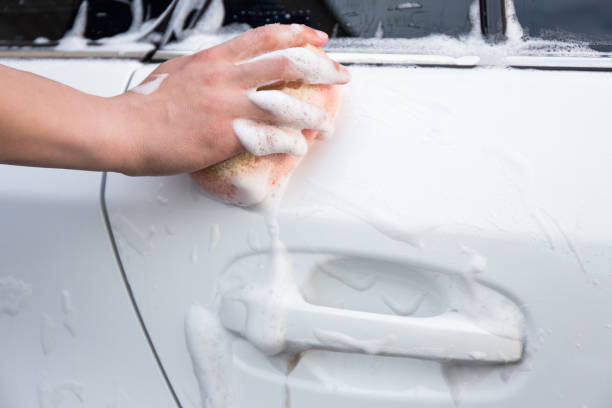 istock handle carwash concept - man washing car with sponge and foam 1274708926