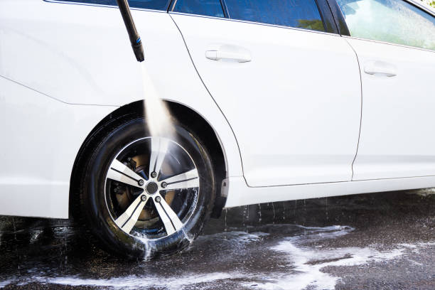 istock car wash with high pressure water and soap 1274709435