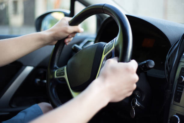 istock male driver hands holding steering wheel 1274709953