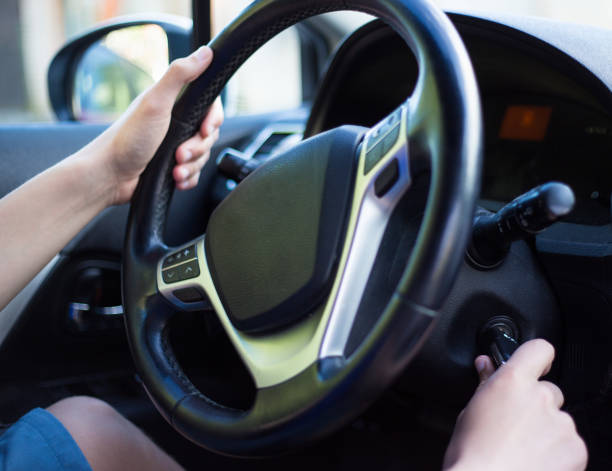 istock driver's hand holding car key for starting the car 1274709963
