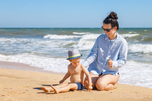 istock mother applying sunscreen cream 1274724071