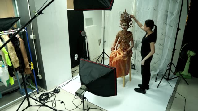 Photographer take photo of Asian Woman model with Thai Asia Traditional Costume