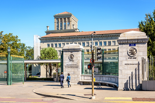 Geneva, Switzerland - September 3, 2020: Entrance of the World Trade Organization (WTO) headquarters, an intergovernmental organization dealing with regulation of international trade between nations.