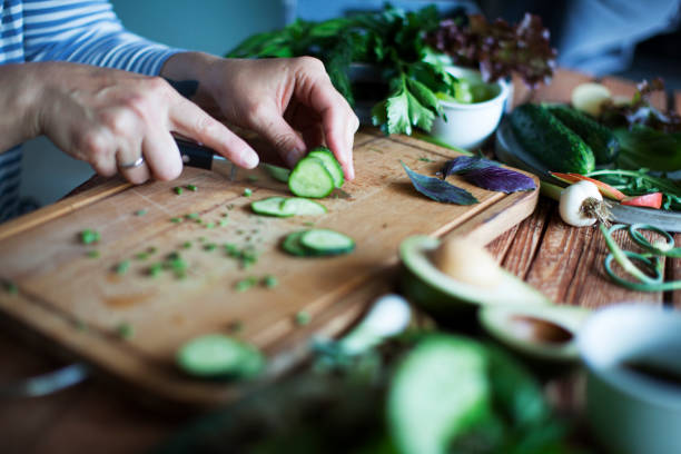 istock slicing vegetables on wooden cutting board 1274733105